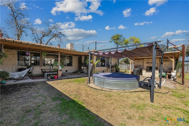 view of yard featuring a swimming pool and a patio area