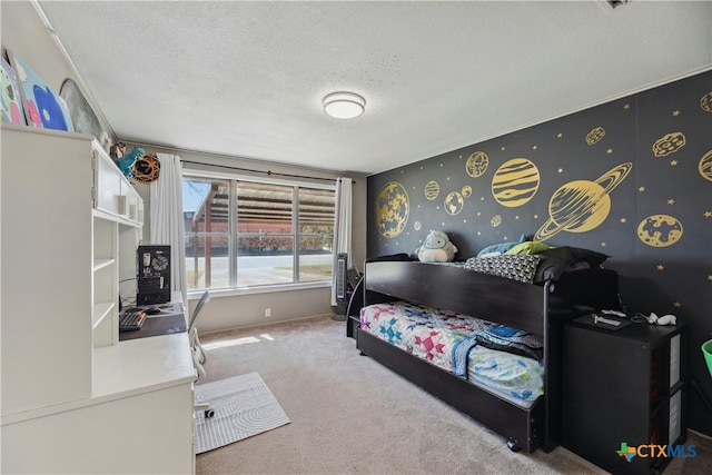 carpeted bedroom with wallpapered walls, baseboards, and a textured ceiling