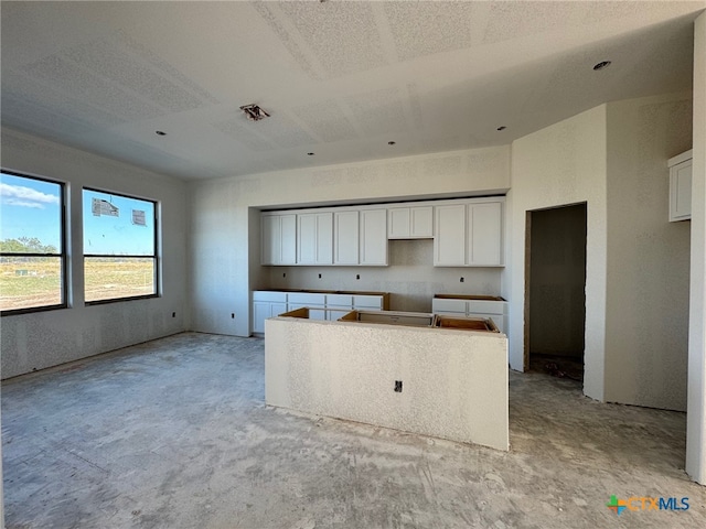 kitchen with white cabinets and a kitchen island