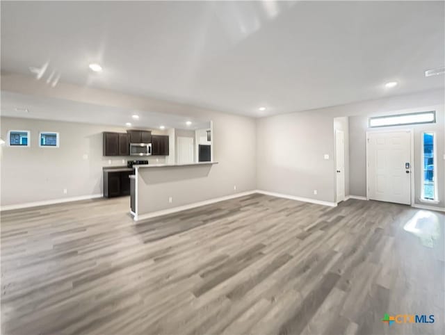 unfurnished living room with light hardwood / wood-style floors