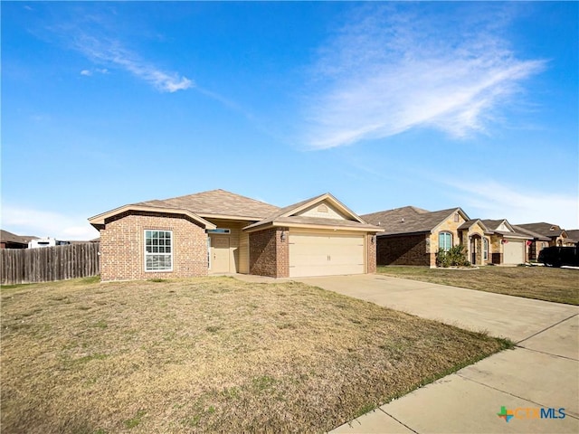 single story home featuring a front yard and a garage