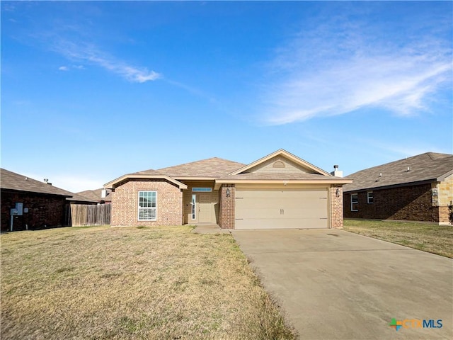 ranch-style home with a garage and a front yard