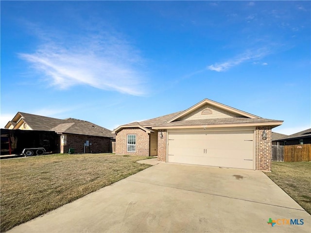 ranch-style house featuring a front lawn and a garage