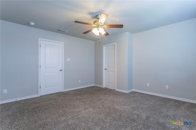 empty room featuring carpet floors and ceiling fan