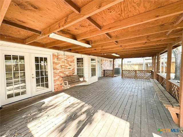 deck with central air condition unit and french doors