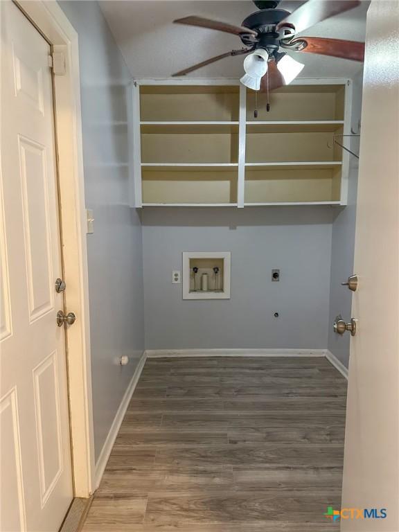 clothes washing area featuring hardwood / wood-style floors, electric dryer hookup, ceiling fan, and hookup for a washing machine