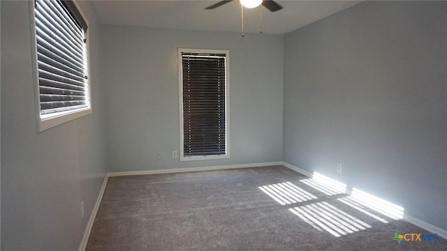 empty room featuring carpet flooring and ceiling fan