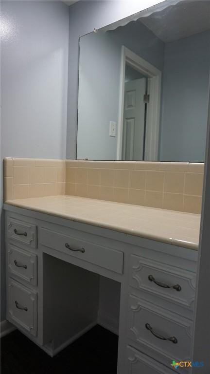 bathroom featuring backsplash and vanity