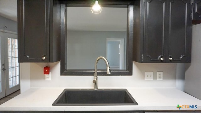 kitchen featuring french doors and sink