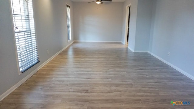 spare room featuring ceiling fan and light wood-type flooring