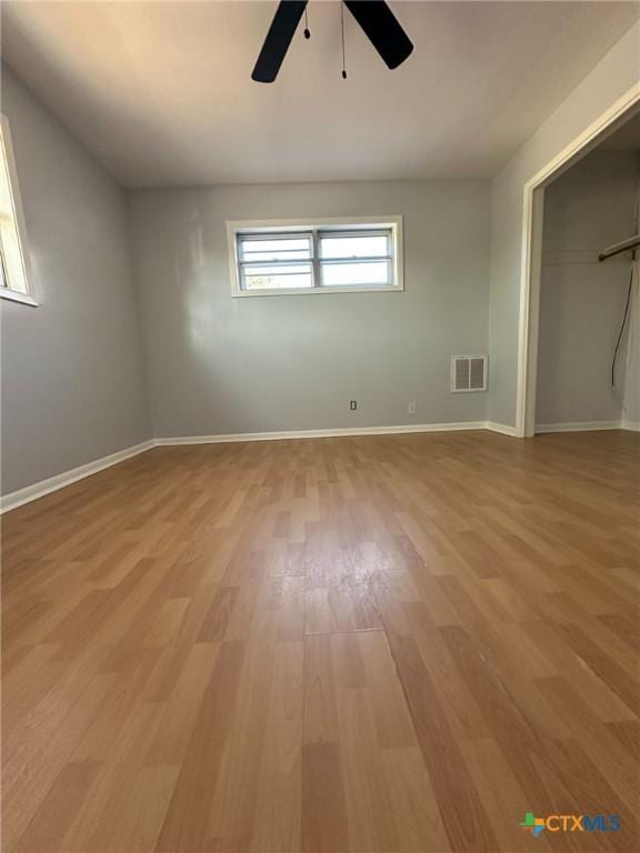 unfurnished bedroom featuring ceiling fan and light wood-type flooring