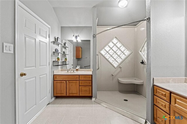 4504 Twin Oaks Cir, Killeen, TX 76542 - bathroom featuring vanity, tile patterned floors, and a shower