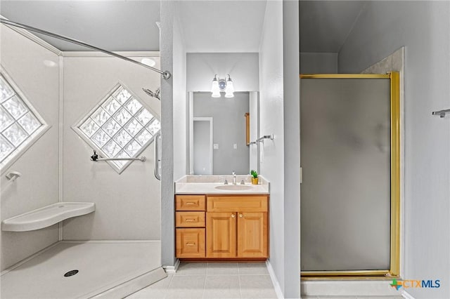 4504 Twin Oaks Cir, Killeen, TX 76542 - bathroom with a stall shower, vanity, tile patterned floors, and plenty of natural light