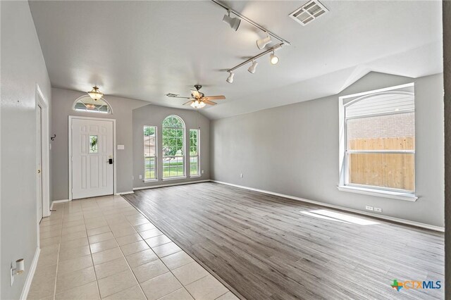 4504 Twin Oaks Cir, Killeen, TX 76542 - entrance foyer featuring vaulted ceiling, ceiling fan, rail lighting, and light tile patterned floors