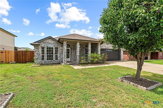 4504 Twin Oaks Cir, Killeen, TX 76542 - view of front facade with driveway, a garage, and brick siding