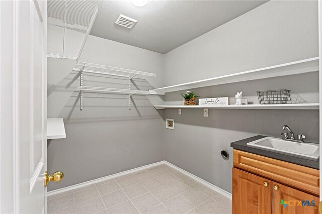4504 Twin Oaks Cir, Killeen, TX 76542 - laundry room featuring hookup for a washing machine and baseboards