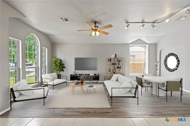 4504 Twin Oaks Cir, Killeen, TX 76542 - living area featuring wood finished floors, ceiling fan, and lofted ceiling