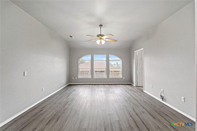 4504 Twin Oaks Cir, Killeen, TX 76542 - unfurnished living room featuring ceiling fan and wood finished floors