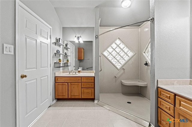 4504 Twin Oaks Cir, Killeen, TX 76542 - bathroom featuring vanity, tile patterned floors, and a shower