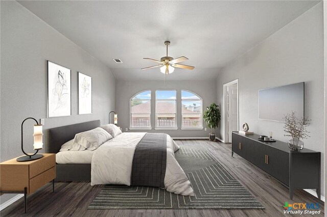 4504 Twin Oaks Cir, Killeen, TX 76542 - bedroom with wood finished floors, vaulted ceiling, and a ceiling fan