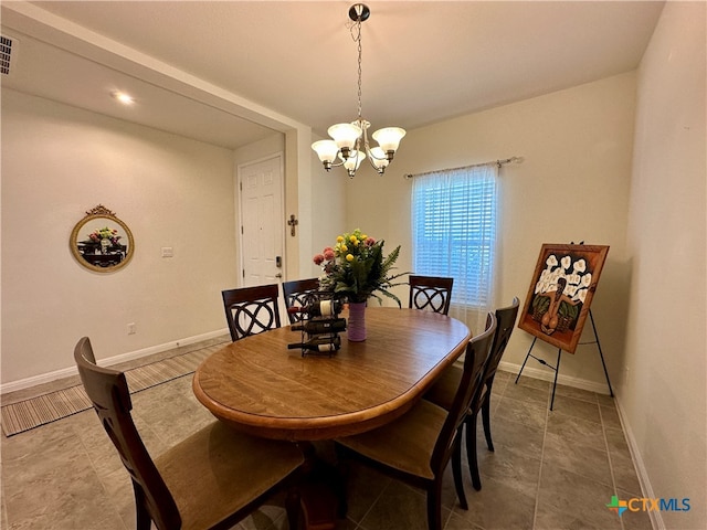 dining room featuring a chandelier