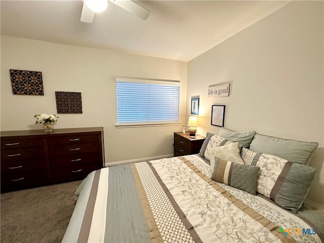 carpeted bedroom featuring lofted ceiling and ceiling fan