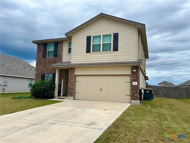 view of front property featuring a garage and a front yard