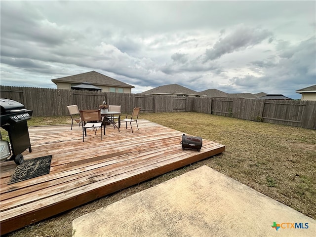 deck featuring area for grilling and a yard