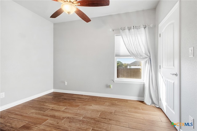 empty room with wood-type flooring and ceiling fan