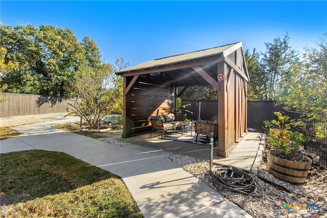 view of patio with a gazebo and an outdoor living space