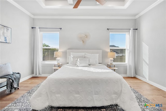 bedroom featuring wood-type flooring, multiple windows, and ceiling fan