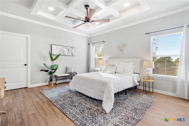 bedroom with ornamental molding, light hardwood / wood-style floors, ceiling fan, and coffered ceiling