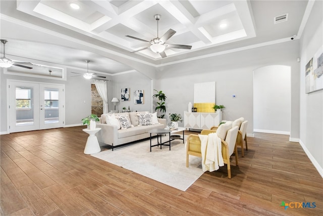 living room with beam ceiling, hardwood / wood-style flooring, french doors, and coffered ceiling