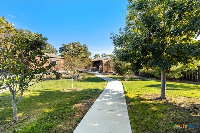 surrounding community featuring a lawn