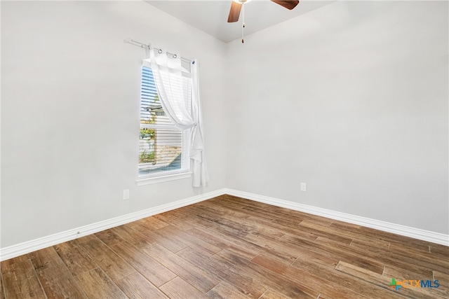 empty room featuring hardwood / wood-style floors and ceiling fan