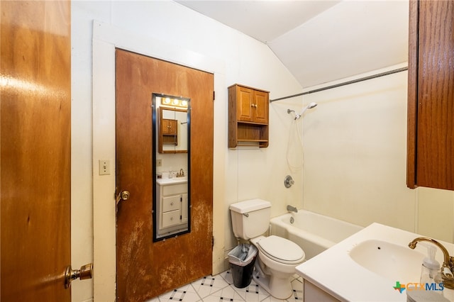 full bathroom with toilet, vanity, lofted ceiling, and bathtub / shower combination