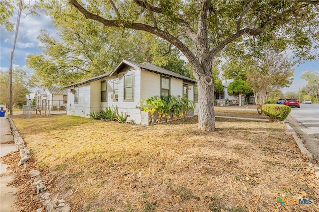 view of property exterior with a lawn