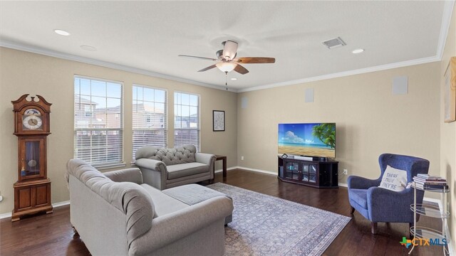 living room featuring dark wood-type flooring, ceiling fan, and crown molding