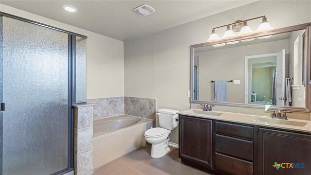 full bathroom with toilet, vanity, tile patterned floors, and plus walk in shower