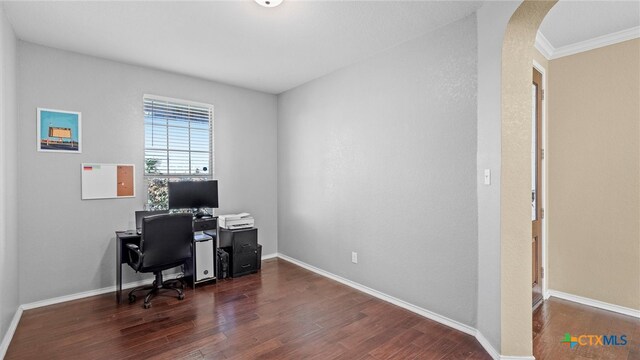 home office featuring dark hardwood / wood-style floors and crown molding