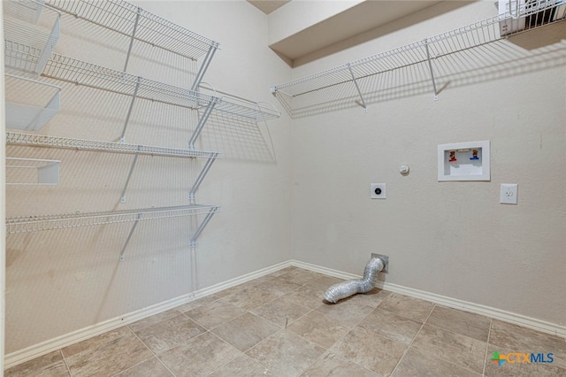 laundry room with hookup for an electric dryer, gas dryer hookup, and hookup for a washing machine