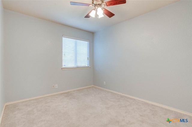 spare room with ceiling fan and light colored carpet