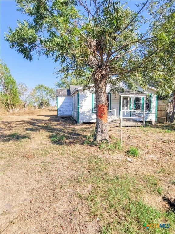 view of yard with a wooden deck