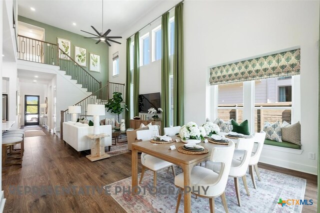 225 Dycus Bnd, Liberty Hill, TX 78642 - dining area with stairs, a towering ceiling, wood finished floors, recessed lighting, and ceiling fan