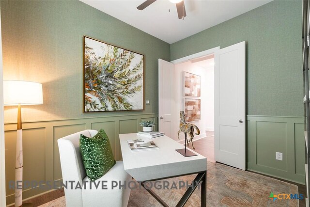 225 Dycus Bnd, Liberty Hill, TX 78642 - home office featuring a decorative wall, a ceiling fan, and wainscoting