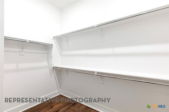 225 Dycus Bnd, Liberty Hill, TX 78642 - spacious closet featuring dark wood finished floors