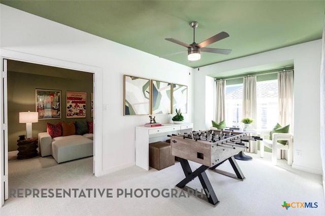225 Dycus Bnd, Liberty Hill, TX 78642 - playroom featuring a ceiling fan, light carpet, and baseboards
