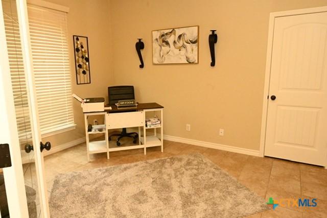 tiled home office with baseboards