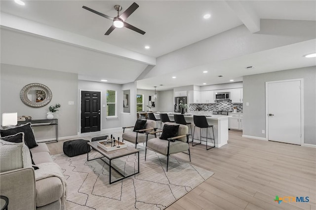 1070 Lonesome Trl, Driftwood, TX 78619 - living room featuring light wood-style flooring, recessed lighting, ceiling fan, and baseboards