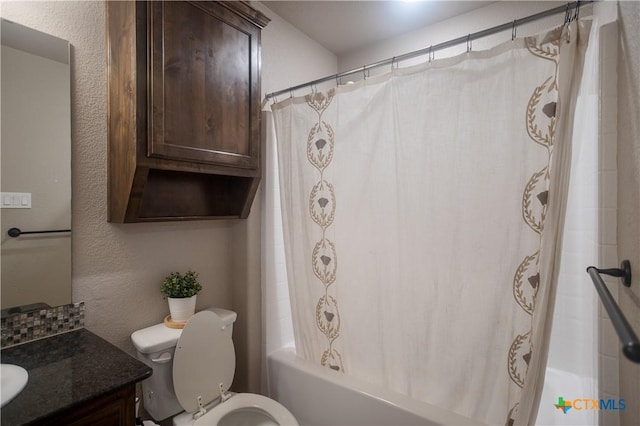 2520 Heartland Ave, Copperas Cove, TX 76522 - full bathroom with vanity, toilet, shower / bath combo with shower curtain, and a textured wall